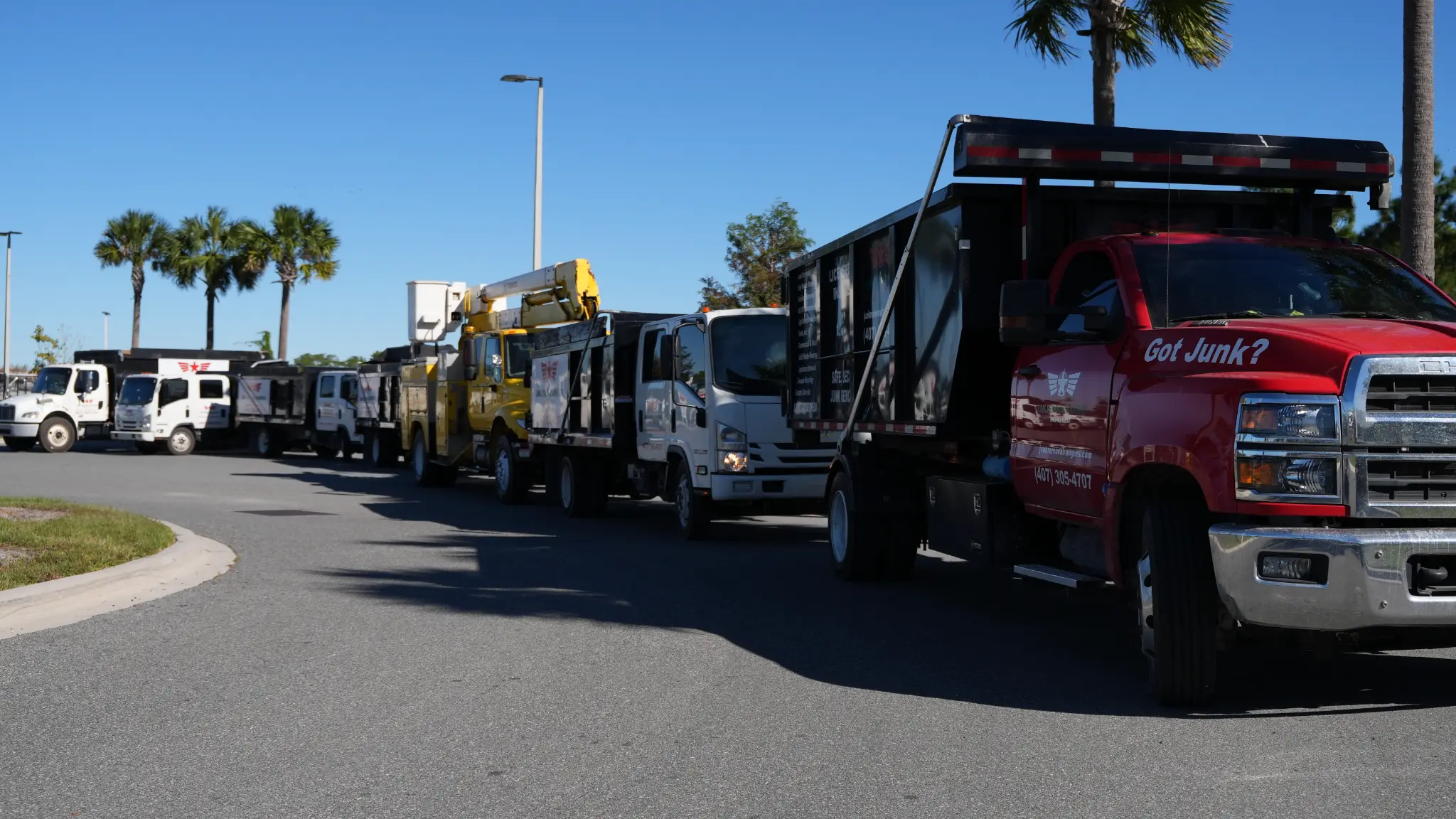 Junk Removal Rangers branded work trucks parked together in Central Florida